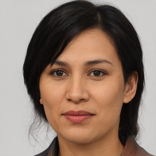 Joyful asian young-adult female with medium  brown hair and brown eyes