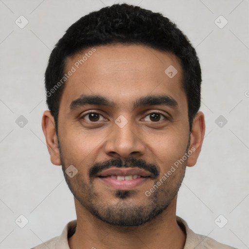 Joyful latino young-adult male with short  black hair and brown eyes