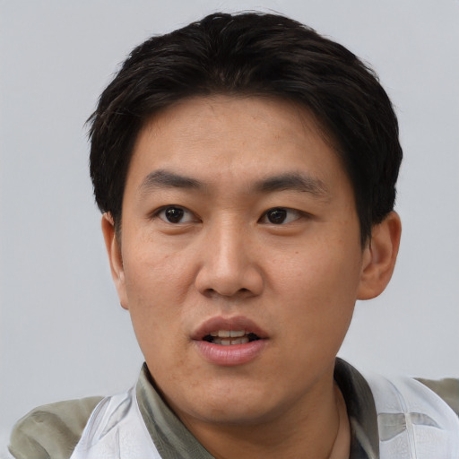 Neutral asian adult male with short  black hair and brown eyes