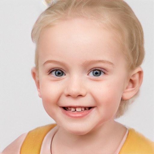 Joyful white child female with short  brown hair and blue eyes