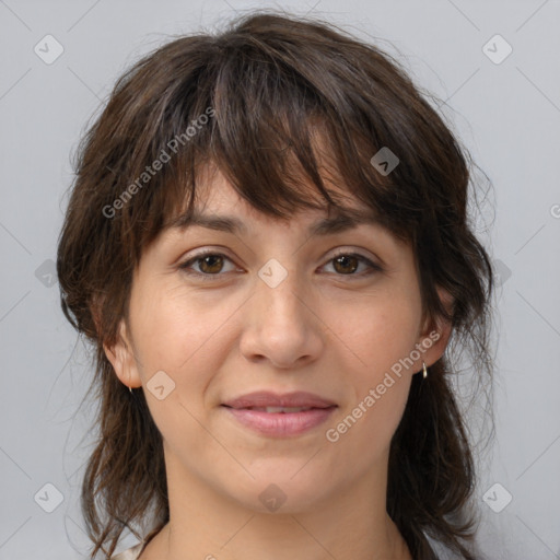 Joyful white adult female with medium  brown hair and brown eyes