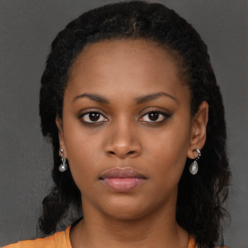 Neutral black young-adult female with long  black hair and brown eyes
