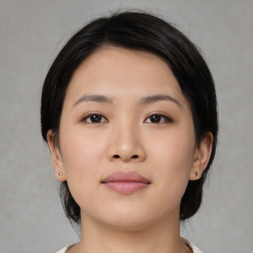 Neutral asian young-adult female with medium  black hair and brown eyes