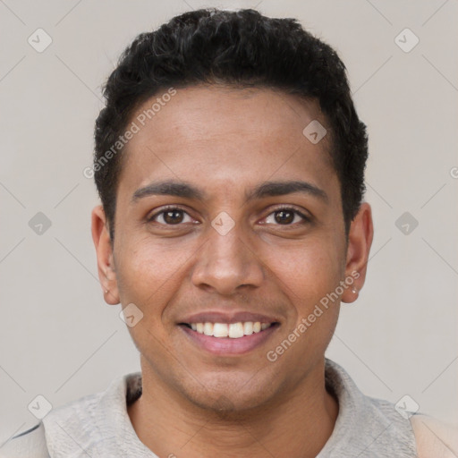 Joyful black young-adult male with short  black hair and brown eyes