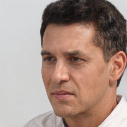 Neutral white adult male with short  brown hair and brown eyes