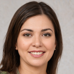 Joyful white young-adult female with medium  brown hair and brown eyes