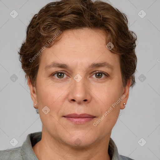 Joyful white adult female with short  brown hair and grey eyes