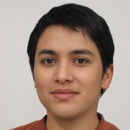 Joyful latino young-adult male with short  black hair and brown eyes