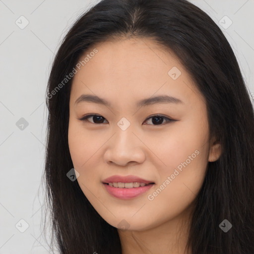 Joyful asian young-adult female with long  brown hair and brown eyes