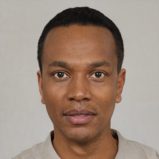 Neutral black young-adult male with short  black hair and brown eyes