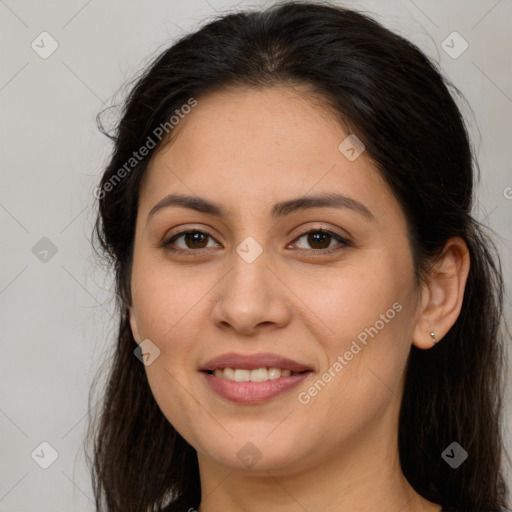 Joyful white young-adult female with long  brown hair and brown eyes