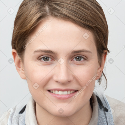 Joyful white young-adult female with medium  brown hair and grey eyes