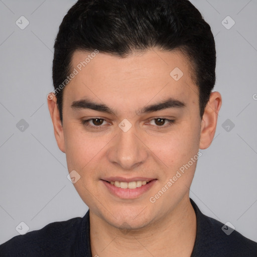 Joyful white young-adult male with short  black hair and brown eyes