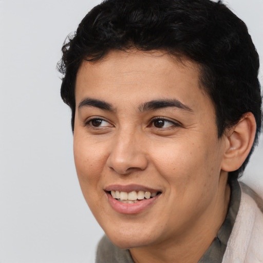 Joyful latino young-adult female with short  brown hair and brown eyes