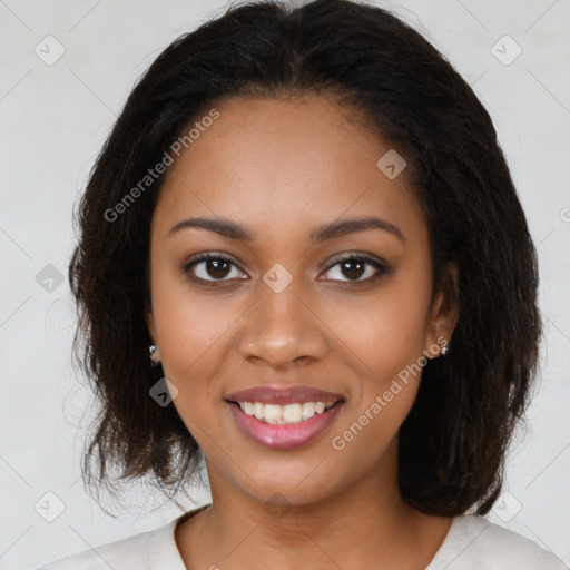 Joyful black young-adult female with medium  brown hair and brown eyes