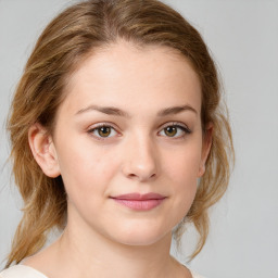 Joyful white young-adult female with medium  brown hair and green eyes