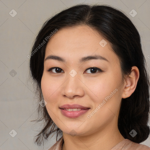 Joyful asian young-adult female with medium  brown hair and brown eyes