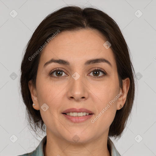 Joyful white adult female with medium  brown hair and brown eyes