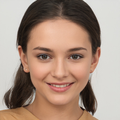 Joyful white young-adult female with medium  brown hair and brown eyes