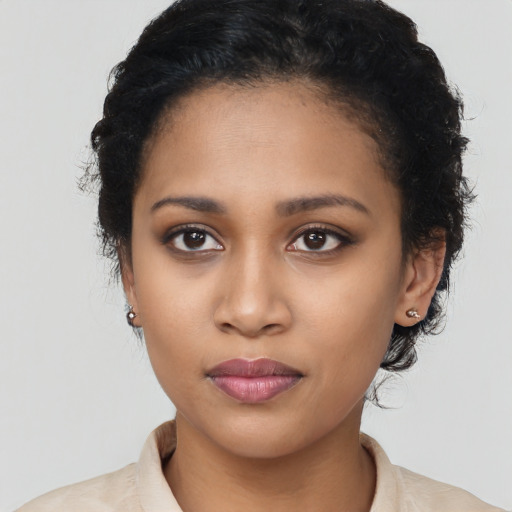 Joyful latino young-adult female with medium  black hair and brown eyes