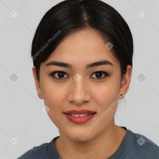 Joyful asian young-adult female with medium  black hair and brown eyes