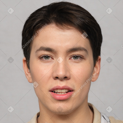 Joyful asian young-adult male with short  brown hair and brown eyes