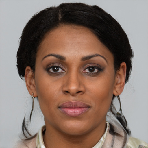 Joyful latino young-adult female with medium  brown hair and brown eyes