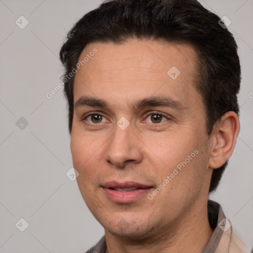 Joyful white adult male with short  brown hair and brown eyes