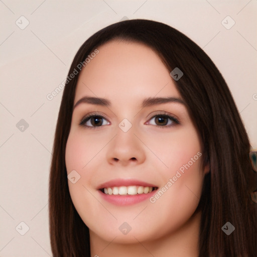 Joyful white young-adult female with long  black hair and brown eyes