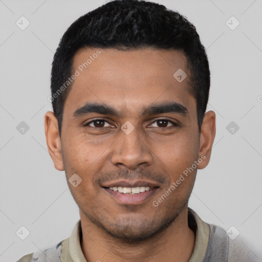 Joyful latino young-adult male with short  black hair and brown eyes