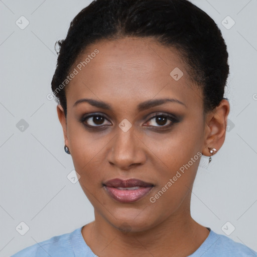 Joyful black young-adult female with short  brown hair and brown eyes