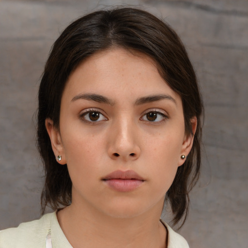 Neutral white young-adult female with medium  brown hair and brown eyes