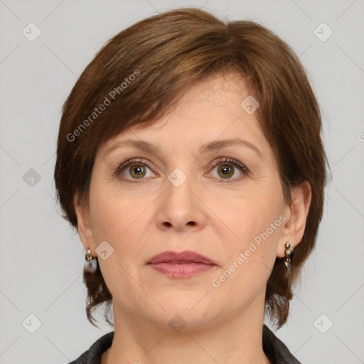 Joyful white adult female with medium  brown hair and grey eyes