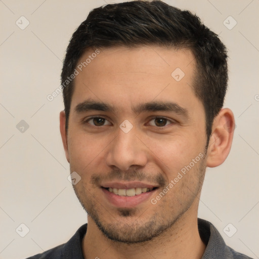 Joyful white young-adult male with short  black hair and brown eyes