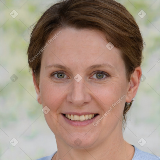 Joyful white adult female with short  brown hair and grey eyes