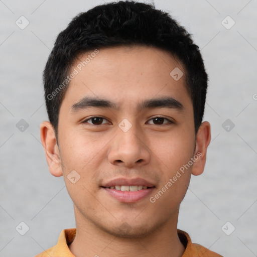 Joyful white young-adult male with short  black hair and brown eyes