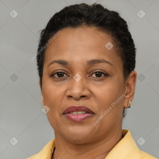 Joyful latino adult female with short  brown hair and brown eyes