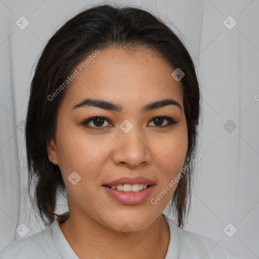 Joyful latino young-adult female with medium  brown hair and brown eyes