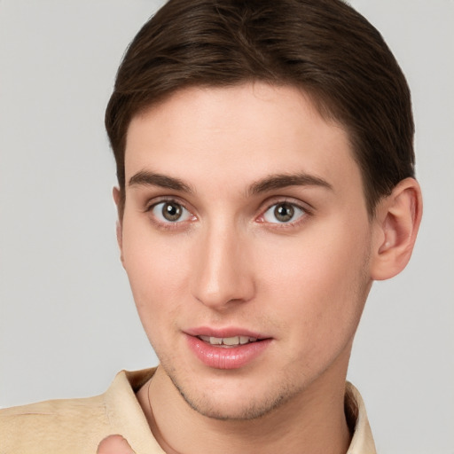 Joyful white young-adult female with short  brown hair and grey eyes