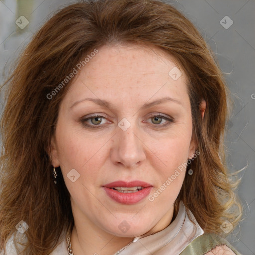 Joyful white adult female with medium  brown hair and blue eyes