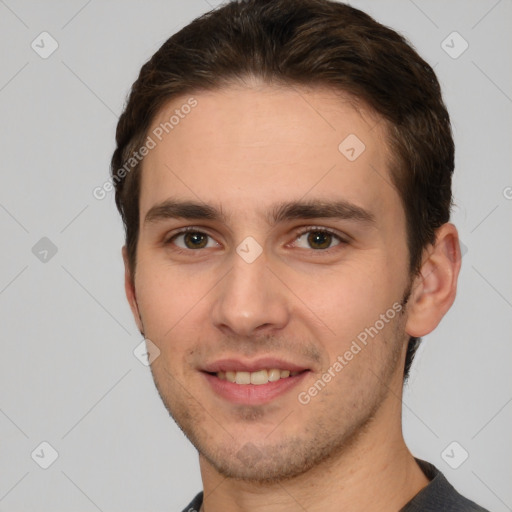 Joyful white young-adult male with short  brown hair and brown eyes