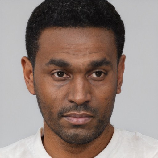 Neutral black young-adult male with short  black hair and brown eyes
