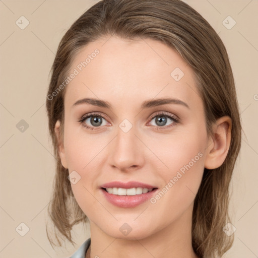 Joyful white young-adult female with medium  brown hair and grey eyes