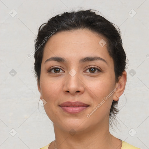 Joyful asian young-adult female with short  brown hair and brown eyes