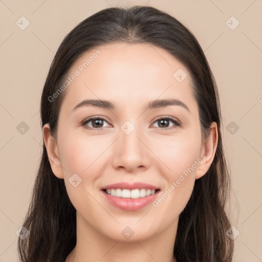 Joyful white young-adult female with long  brown hair and brown eyes