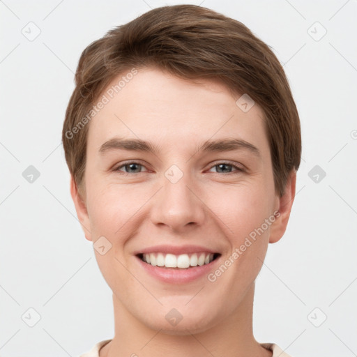 Joyful white young-adult female with short  brown hair and grey eyes