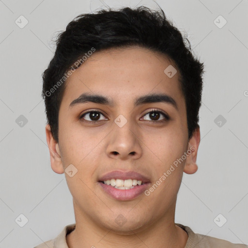 Joyful latino young-adult male with short  brown hair and brown eyes