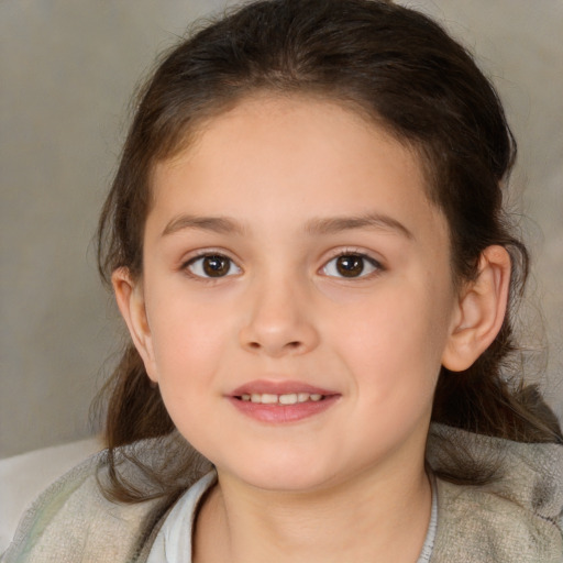 Joyful white child female with medium  brown hair and brown eyes