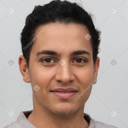 Joyful latino young-adult male with short  brown hair and brown eyes