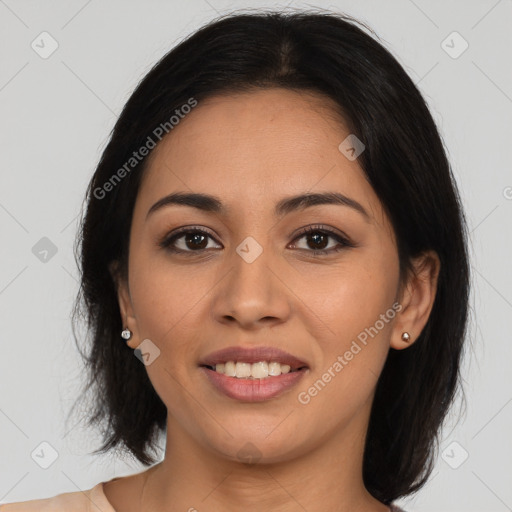 Joyful latino young-adult female with long  brown hair and brown eyes